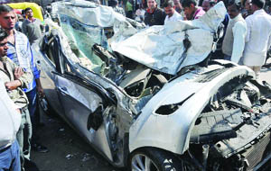 The mangled remains of a Hyundai car which hit the Punjab Roadways bus near Kashmere gate in New Delhi on Thursday.