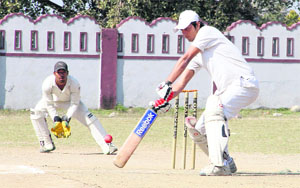 A batsman in action during a match in the 61st Dehradun District Cricket League in Dehradun on Thursday. 