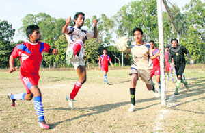 Players in action during a match in the 21st Narayan Gurung Memorial Football Tournament in Dehradun on Thursday.