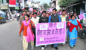 Pawan Kajal, MLA, leads women protesters on One Billion Rising Day campaign on the Dharamsala-Kangra road on Thursday. 