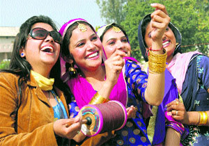 Students of the Lyalpur Khalsa College for Women celebrate Basant Panchami by flying a kite in Jalandhar on Thursday.