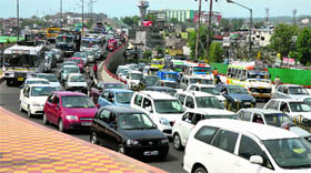 Huge rush of traffic on a road in Jammu on Thursday.