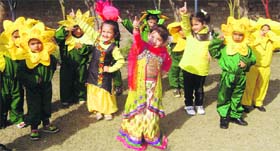 Students present a dance item to celebrate Basant Panchami at Green Land Public School in Ludhiana on Thursday