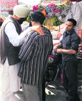PPP chief Manpreet Badal with a voter in Moga. 