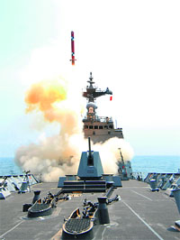 South Korean navy destroyer launches an indigenous cruise missile at an undisclosed location on Thursday.