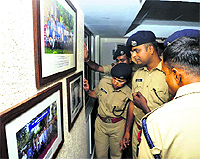 Cadets of the National Police Academy look at the works of Sumeet Dua at an exhibition in Hyderabad