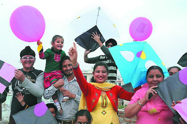 Residents celebrate on the occasion of Basant Panchami at Guru Tegh Bahadur Nagar in Bathinda on Friday.