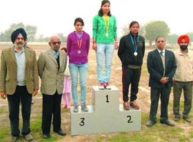 Dr Jai Rup Singh (extreme left), VC, Central University, along with the winners of the 200 metre race on Friday. The winners were Shefali (1st), Shruti Chaudhary (2nd) and Jaskiran.
