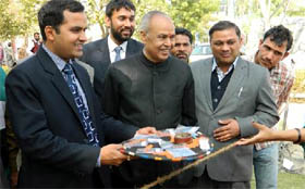 Deputy Commissioner KK Yadav (left) and the VC, GKU, SK Ahluwalia inaugurating the Lok Mela on Friday.