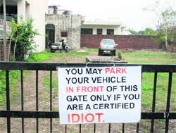 A notice put up outside the residence of the accused at Sector 12 in Panchkula. Tribune photo: Nitin Mittal 
