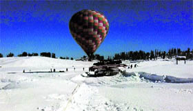 People enjoy a hot air balloon ride in Gulmarg on Friday.