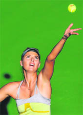 Maria Sharapova serves during her win over Samantha Stosur in the Qatar Open on Friday. 