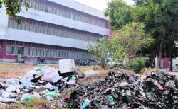 Biomedical waste, a part of which has been burnt, lies in the open at the ESI Hospital in Amritsar. Photo: Vishal Kumar 