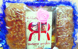 The wedding invite itself is an example, a complete package with the card replacing the word wedding with celebration of togetherness, along with two books on relationships as gifts.