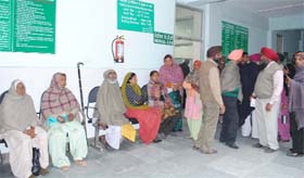 Patients queue up and wait outside the out-patient department (OPD) at the Civil Hospital in Bathinda on Saturday as the doctors of the Punjab Civil Medical Services (PCMS) went on strike