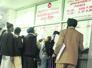 Patients and their attendants line up at the radiology counter at the PGI in Chandigarh. 