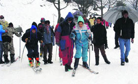 Tourists enjoy skiing at Nehru Kund near Manali on Saturday.