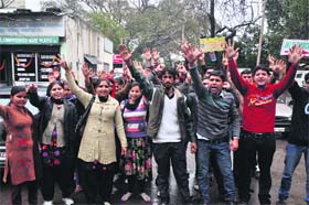 Activists of the J&K NYC stage protests to demand job regularisation, outside the Exhibition Ground in Jammu on Saturday