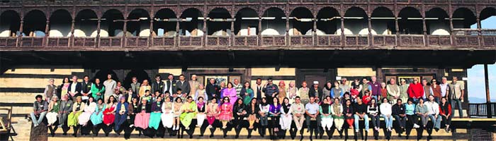 A group photograph of the direct descendants of SN Stokes who were present on the first day in the verandah of Harmony Hall