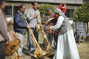 The photograph shows a puja of the baja. It is being blessed or propitiated