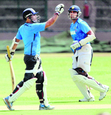 Virender Sehwag and M Vijay train at Chinnaswamy Stadium in Bengaluru on Saturday.