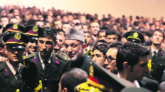 Afghan President Hamir Karzai (R) at the National Military Academy in Kabul on Saturday.