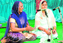 Women sing folk song at Mela charkhe da at Butala village near Amritsar on Sunday