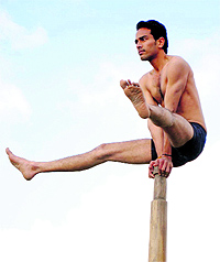 A student of DAV College participates in the malkhamb competition in Amritsar on Sunday