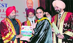 A student is being awarded a degree by Governor of Arunachal Pradesh Gen JJ Singh (retd) during 107th annual convocation of Khalsa College in Amritsar on Sunday