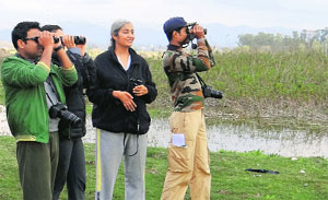 A team of bird watchers spot birds at Dhakoli, Zirakpur, on Sunday.