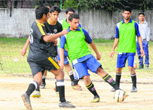 A football match in progress during the All-India Medical Football Championship in Chandigarh on Sunday.