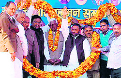 Bahujan Samaj Party leaders wave at the crowd at the Saini community convention in Roorkee on Sunday