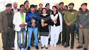 Winners of a talent show along with the chief guest and senior police officers in Reasi on Sunday. 