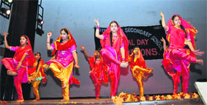 Schoolstudents take part in a cultural programme in Jammu on Sunday. 