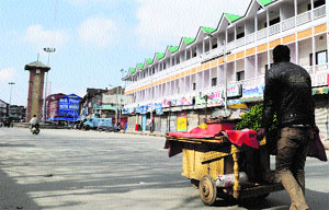 A vendor sells vegetables on a handcart at Lal Chowk after curfew was lifted in Srinagar, on Sunday. 