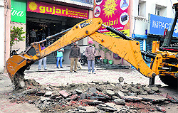 The anti-encroachment drive in progress on Ferozepur Road in Ludhiana on Sunday