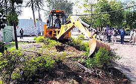 The anti-encroachment drive in progress on Ferozepur Road in Ludhiana on Sunday