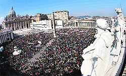 People are gathered at St Peter's Square as Pope Benedict XVI leads his Sunday Angelus prayer in the Vatican on Sunday
