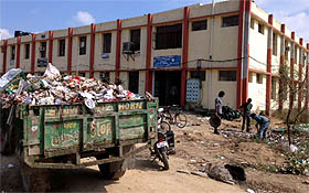 Muktsar Municipal Council workers lift garbage from the District Administrative Complex on Monday.