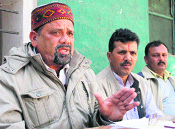Trivendra Singh Panwar, president of the UKD, addresses a press conference in Dehradun on Monday.