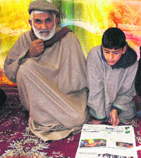 Afzal Gurus son Ghalib with his maternal grandfather.