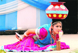 A college student performs at a cultural programme during Synergy 2013 at Lyallpur Khalsa College in Jalandhar on Monday.