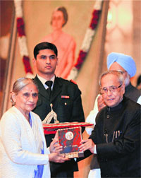 President Pranab Mukherjee presents the Indira Gandhi Prize for Peace Award 2011 to Ela Bhatt, founder, Self-Employed Women's Association of India (SEWA), in New Delhi on Monday.