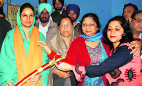 Bathinda MP Harsimrat Kaur being honoured in Moga on Monday.
