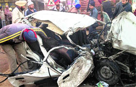 Mangled remains of the car that met with an accident on the Kurali-Ropar national highway on Monday.