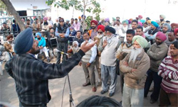 Nirmal Singh Dhaliwal, state president, All India Trade Union Congress (AITUC), addresses PRTC workers in Bathinda on Tuesday. Tribune photo: Pawan Sharma