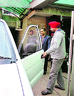 CBI officers come out after raiding the residence of former Transport Minister and MLA Om Prakash Jain at Model Town in Panipat on Tuesday in connection with former sarpanch Karam Singhs murder cas