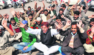 Members of the Gujjar and Bakarwal tribes stage a protest in support of their demands in Jammu on Tuesday. 
