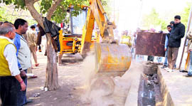 MC workers during the anti encroachment drive in Ludhiana on Tuesday.