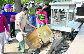 MC workers during the anti-encroachment drive in Ludhiana on Tuesday.
